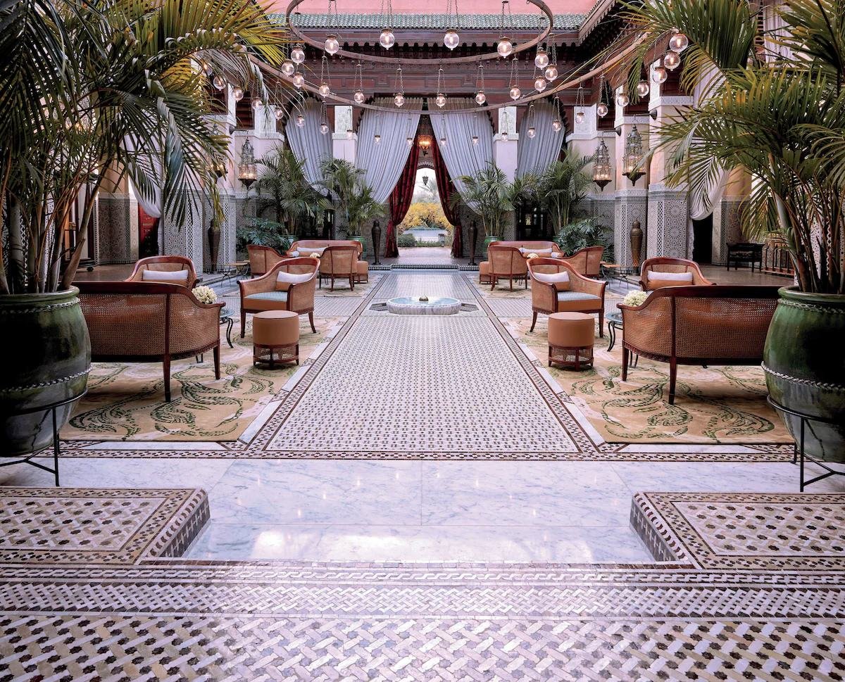 Courtyard of a palace riad with zellige floors and lanterns in Marrakech